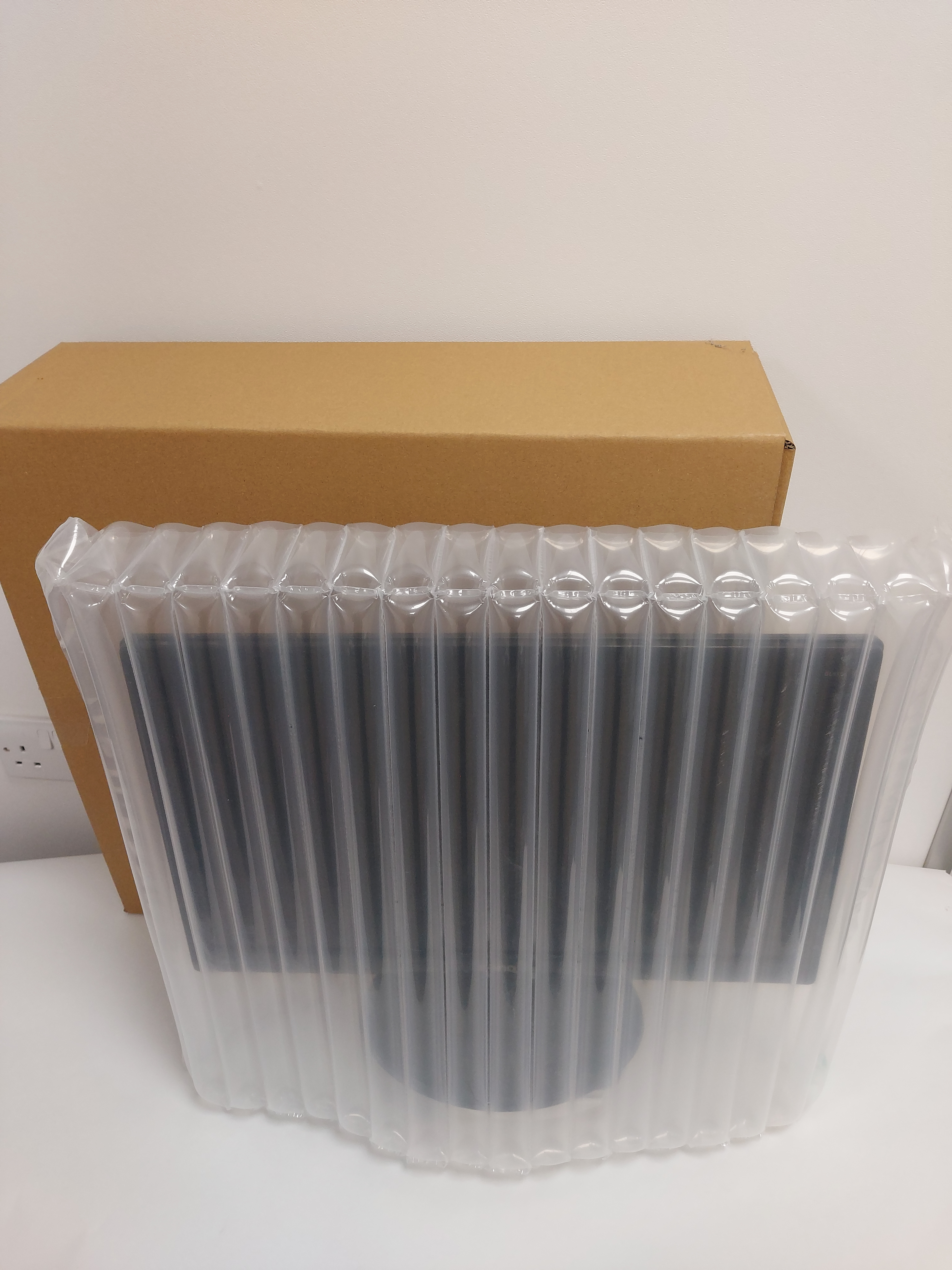 Monitor pack monitor inside inflatable bag with box